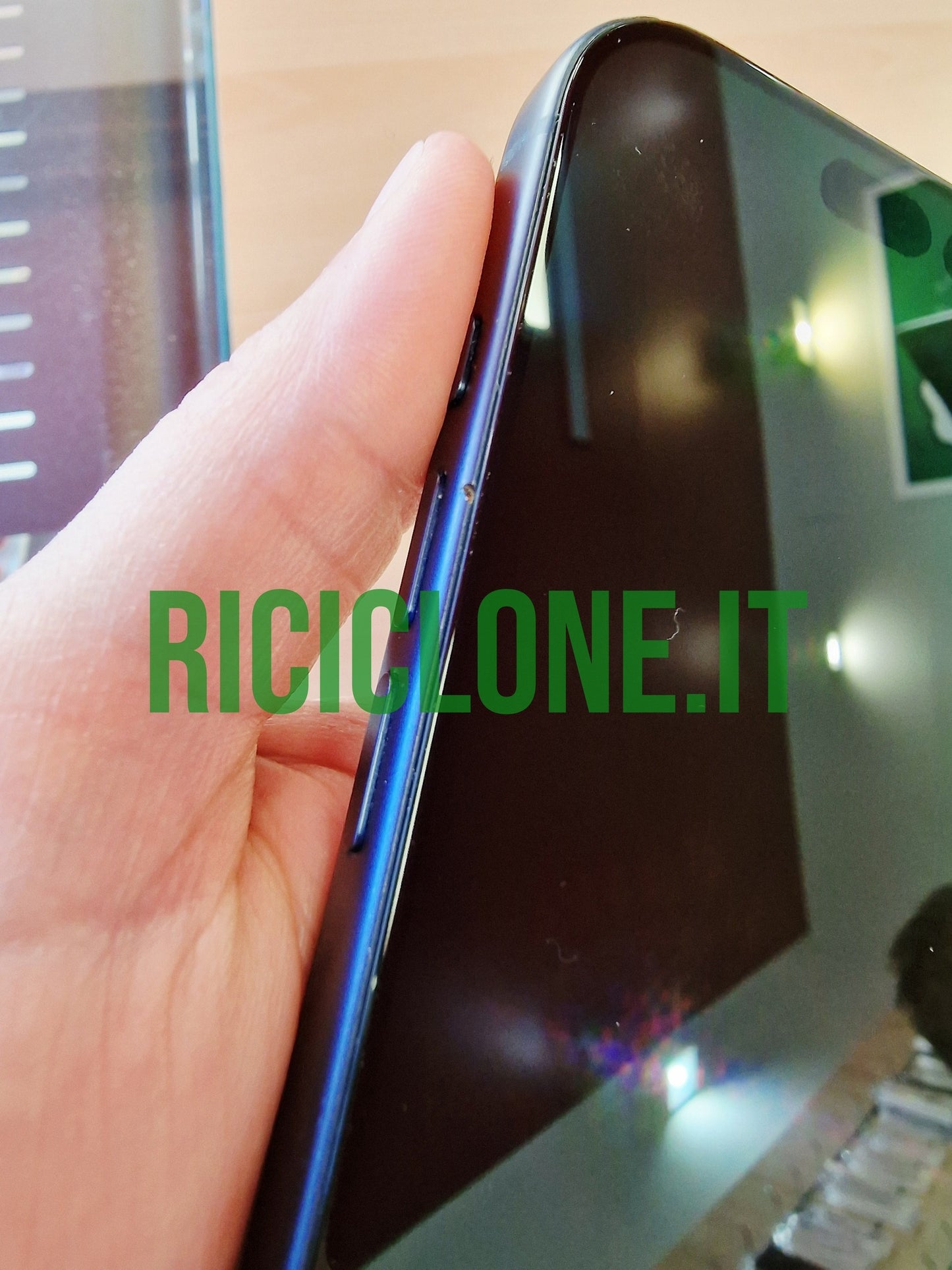 Side profile of refurbished blue iPhone 17 Pro showing metallic frame and buttons