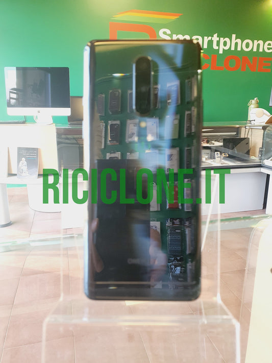 OnePlus 8 black smartphone rear view with vertical camera module and glossy finish