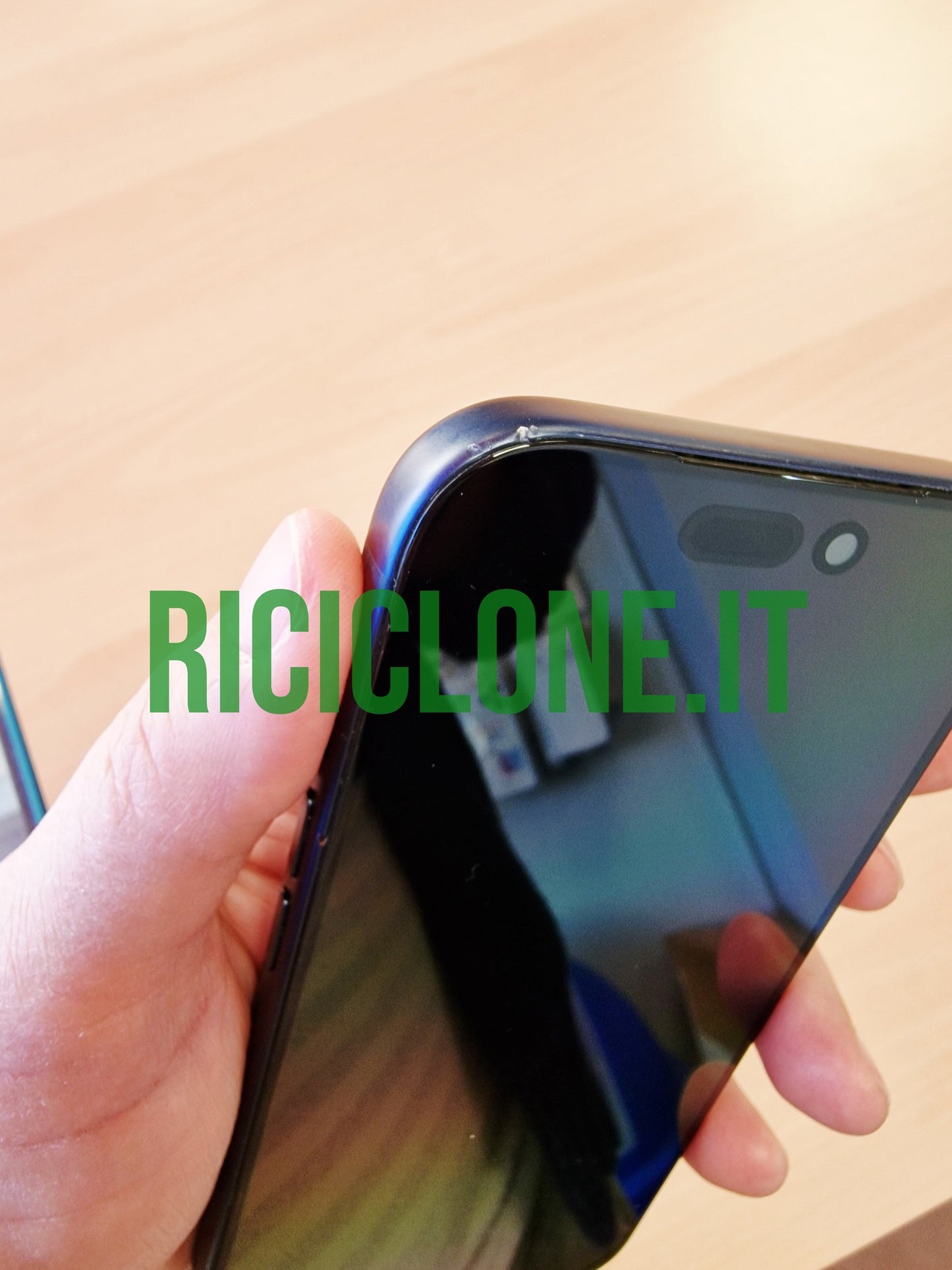 Close-up of top corner on blue iPhone 17 Pro showing notch and minor wear