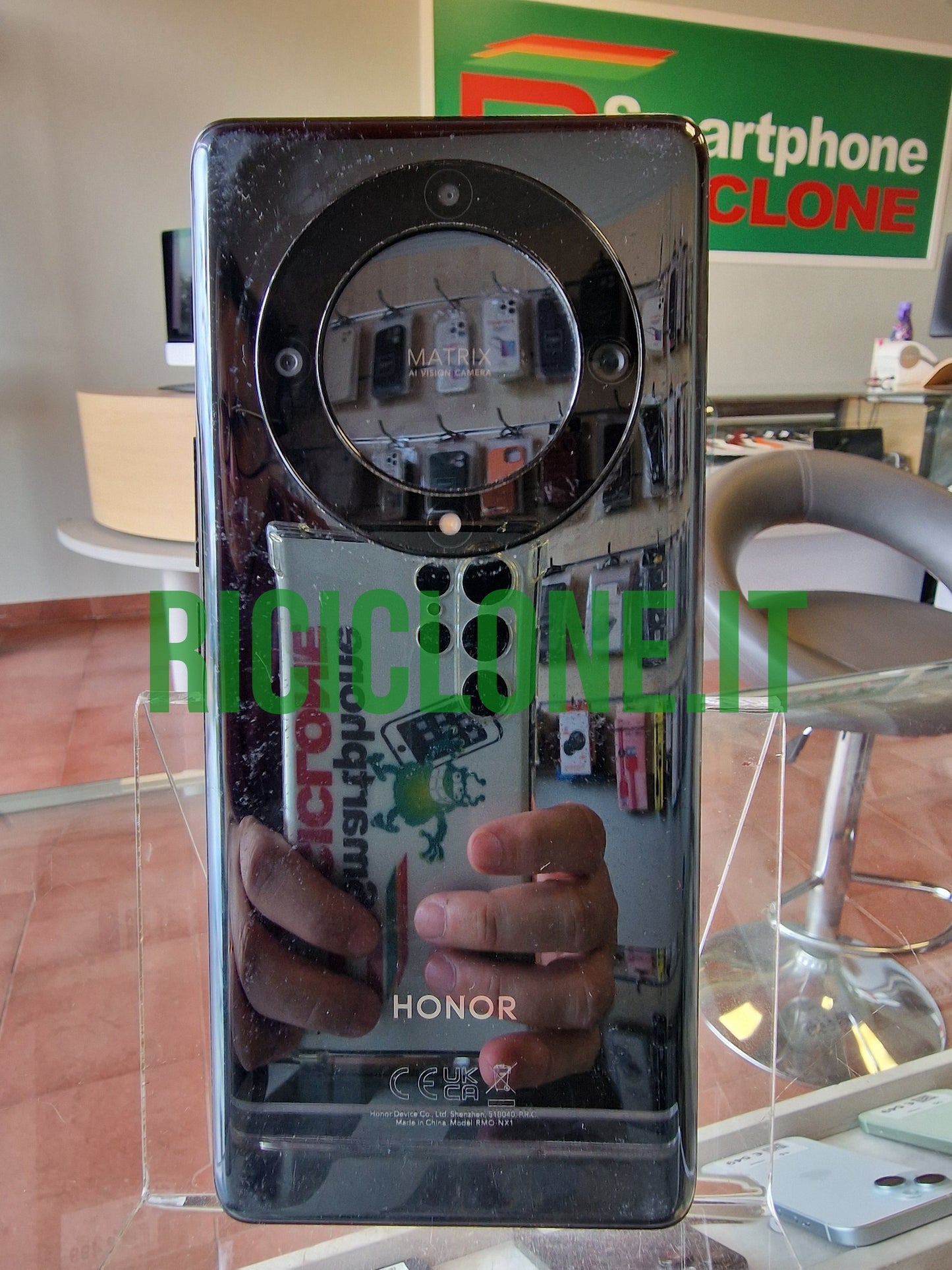 Honor Magic5 Lite black smartphone back view showing glossy glass finish and Matrix AI Vision Camera module